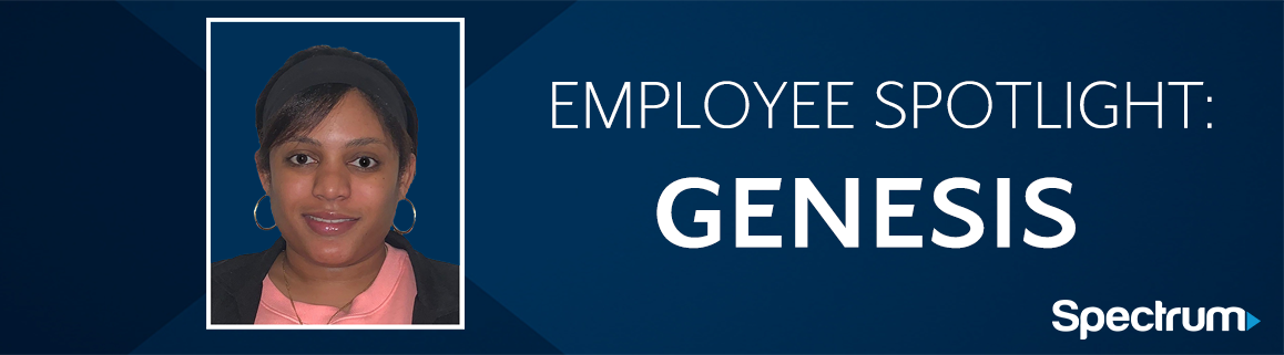 Employee Spotlight: Genesis. Image of a woman with dark hair and eyes wearing a pink shirt and black cardigan.